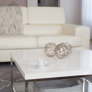 A white coffee table in front of a couch